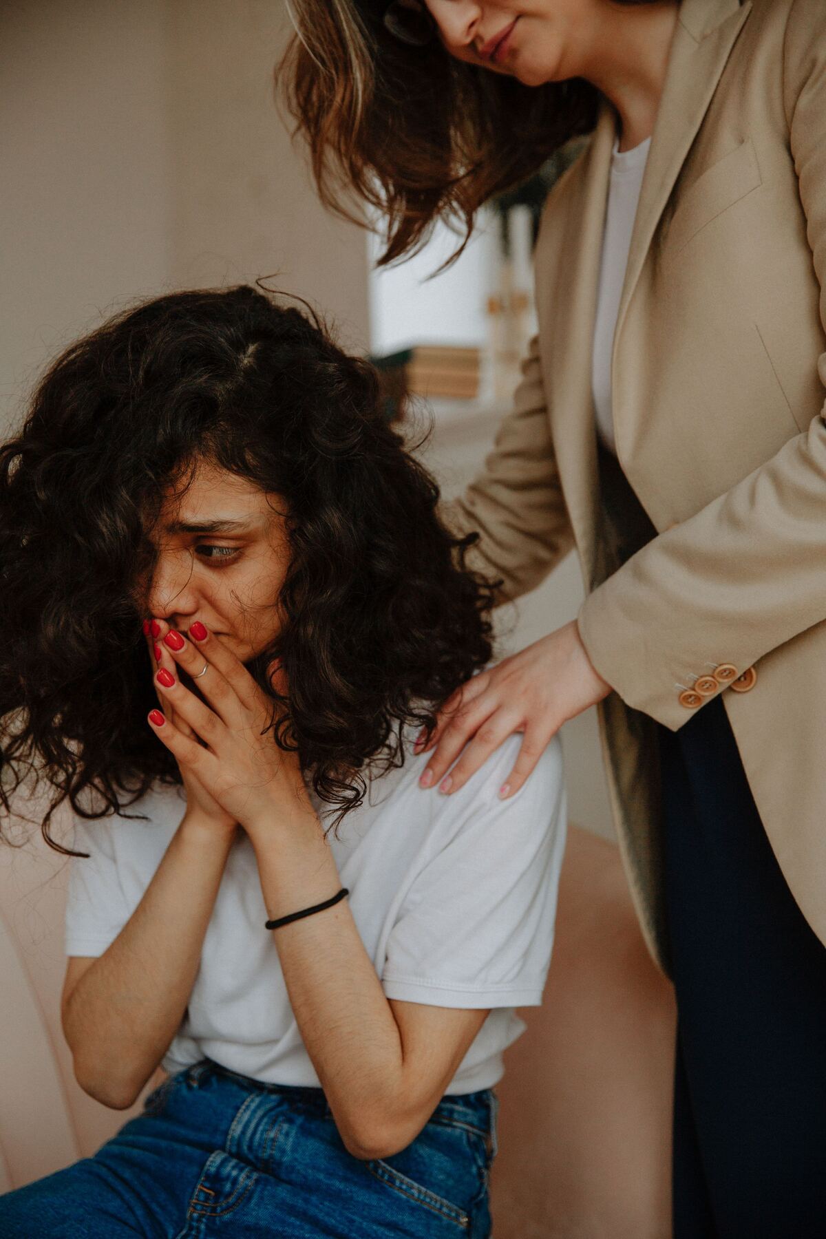 A supportive moment between a counsellor and a client during a session
