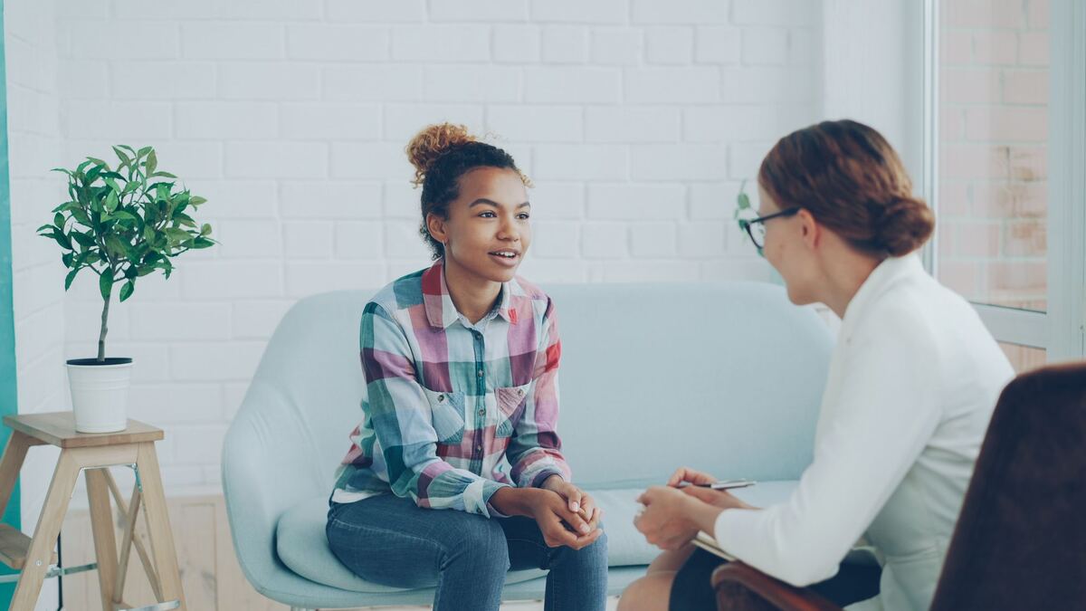 A client in conversation with a counsellor in a consulting room